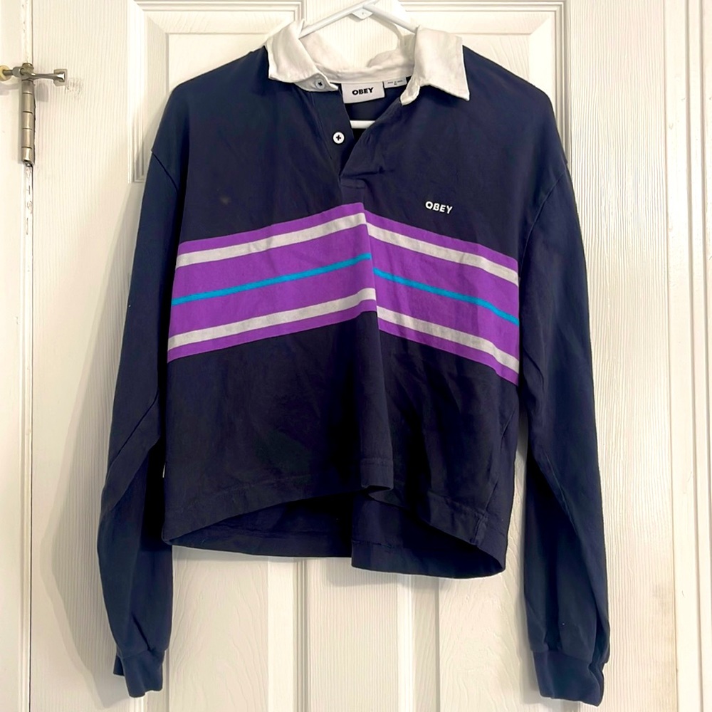 Trendy Obey collard long sleeve with purple white and blue stripes.